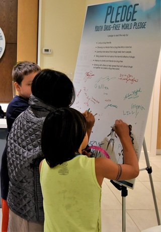 Youth taking the pledge to be Drug-Free at the Florida headquarters for the Foundation for a Drug-Free World